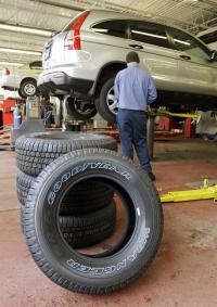 Tire maker Goodyear posts $11M loss for 1Q on charge for refinancing, revenue edges up