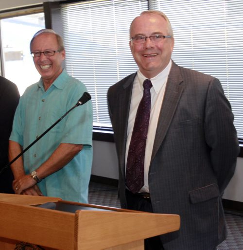 At right, Bob Downs, Development Manager with Shindico and Mayor Sam Katz at the Canad Inns Stadium site Thursday to announce the proposed sale of the Polo Park stadium site for $30.35 million to Polo Park Holdings L.P. made up of Cadillac Fairview and Shindico Realty. Bart Kives story (WAYNE GLOWACKI/WINNIPEG FREE PRESS) Winnipeg Free Press June 28 2012