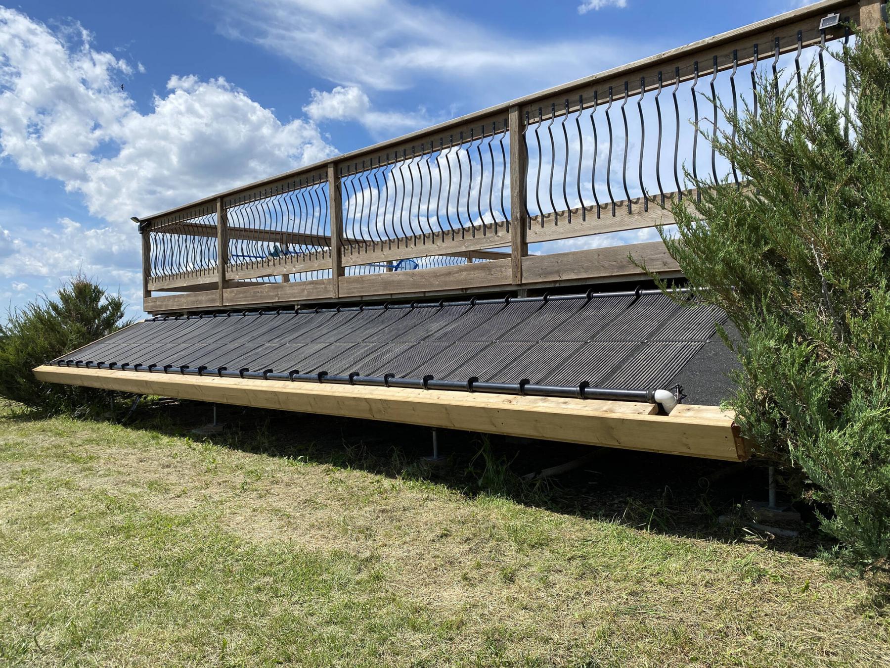 <p>Photos by Marc LaBossiere / Winnipeg Free Press</p><p>The solar heating array for the pool consists of ABS headers connected to rubber tubing panels that rest atop a structure coated with roll roofing, angled towards the sun.</p>