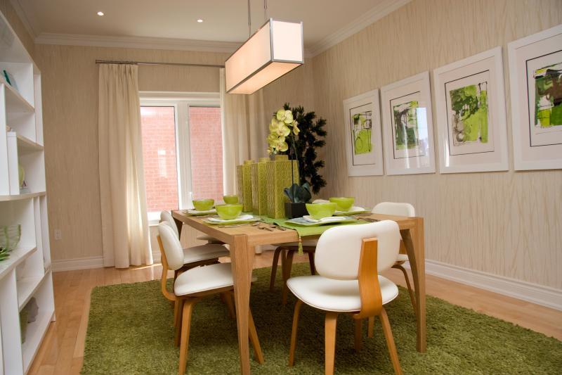 The contemporary series of prints are simply framed and enhance the natural palette of the calm dining room setting.