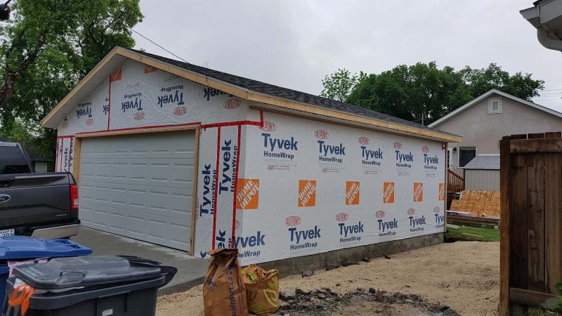 <p>Sue and Rick Kizuk missed having a garage at their new house, so they built one for just under $25,000. </p>