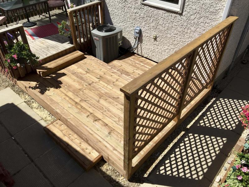 <p>Marc LaBossiere / Winnipeg Free Press</p><p>The new lower deck tier covers the area which was previously only a gravel base and features a low step to the existing higher tier and an inset to accommodate the A/C.</p>