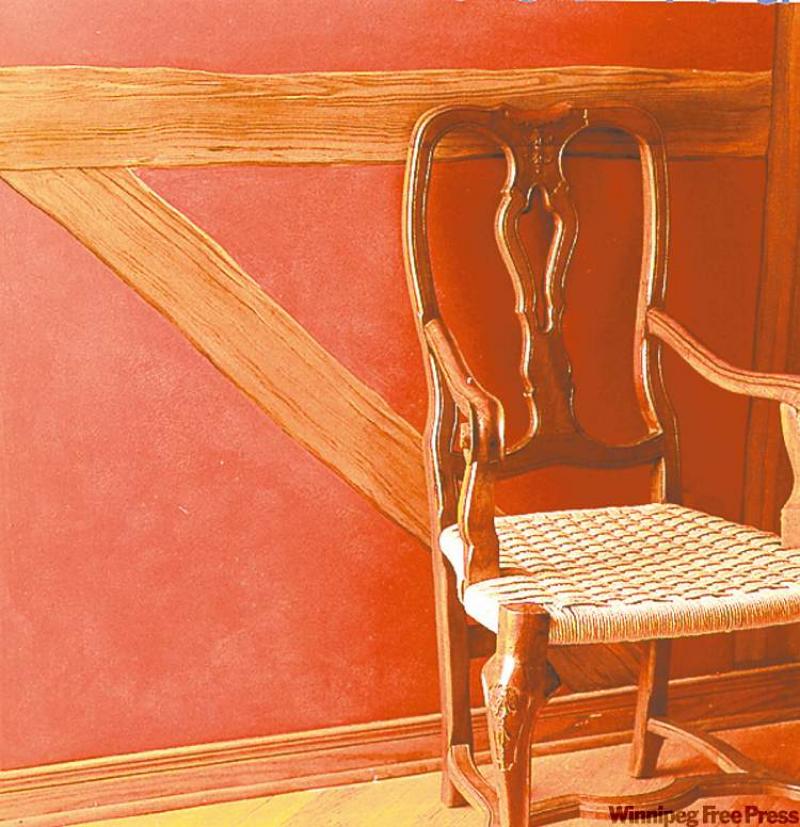 A rubbed red paint finish looks warm and comfortable along with the natural and painted wood trim.