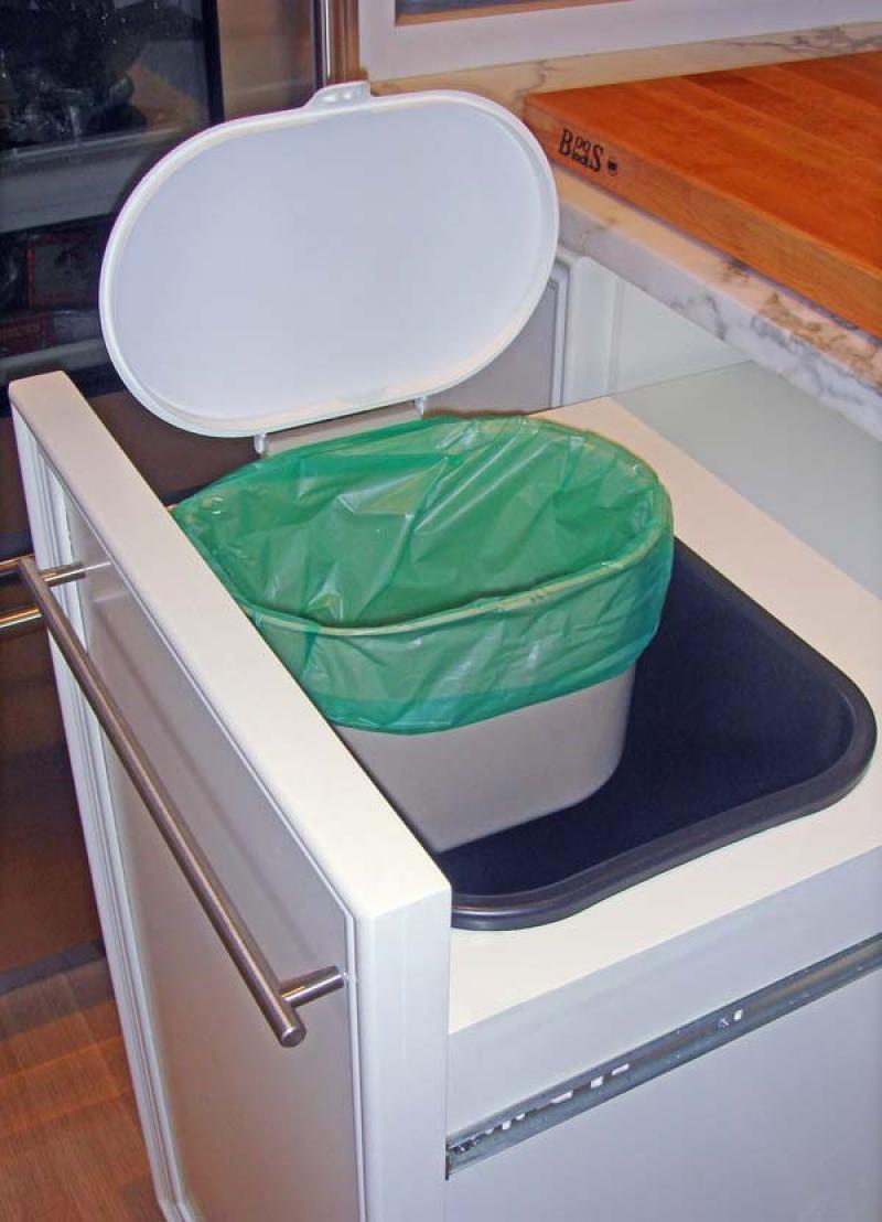 Recycling is made harder by the fact that many homes have no convenient provisions for collecting compost material or storing plastics, paper and other recyclables.  A drawer such as this helps consid