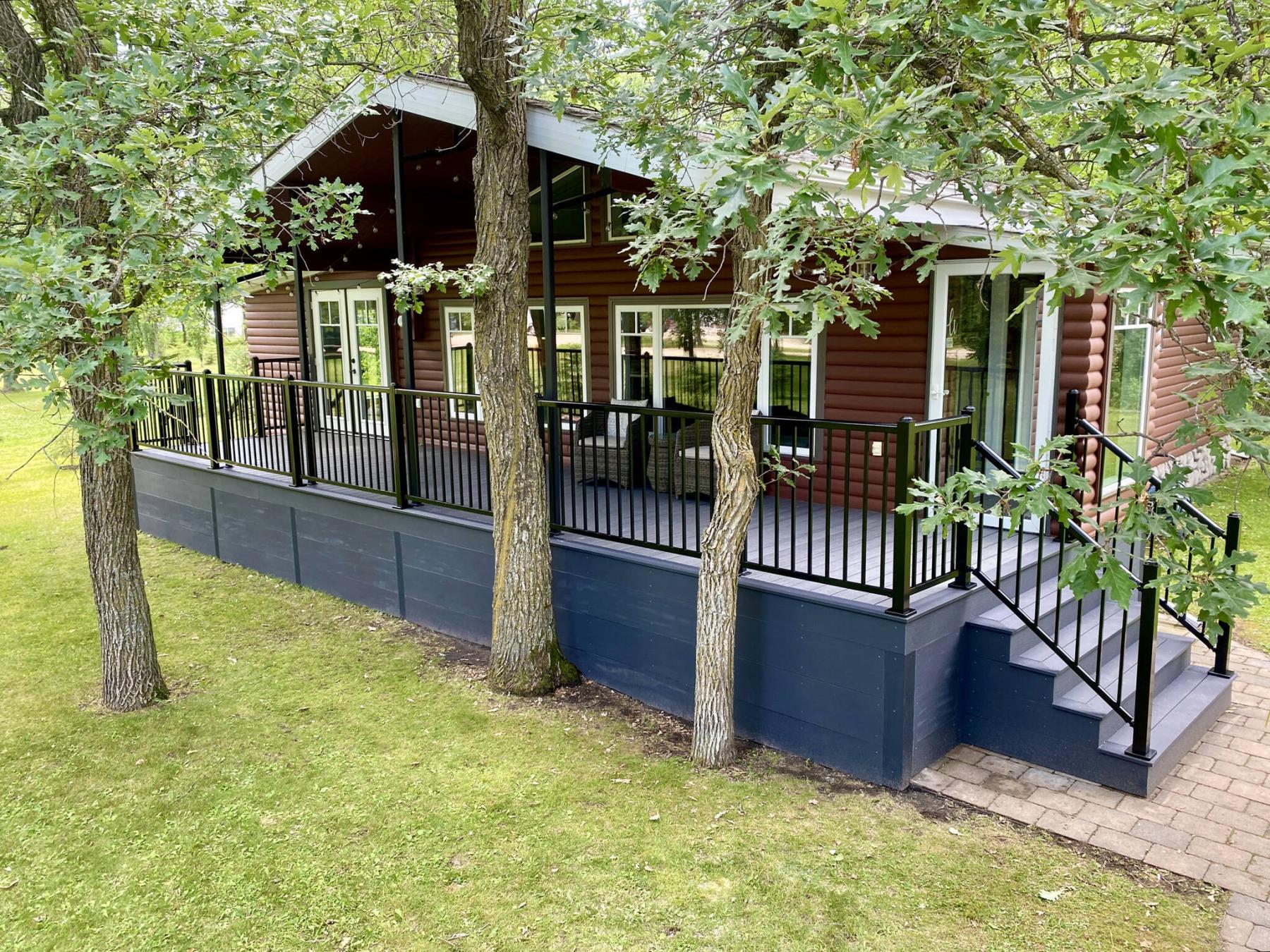  <p>MARC LABOSSIERE / FREE PRESS</p>
                                <p>The old lumber tops and skirt were removed from this covered front porch and replaced with two-tone composite decking and aluminum railings.</p> 