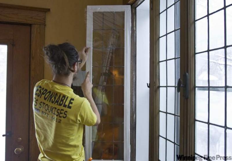 Adding a thin, clear plastic film to a window formsa barrier that helps to prevent the cold surface of the glass from lowering the room's temperature. 