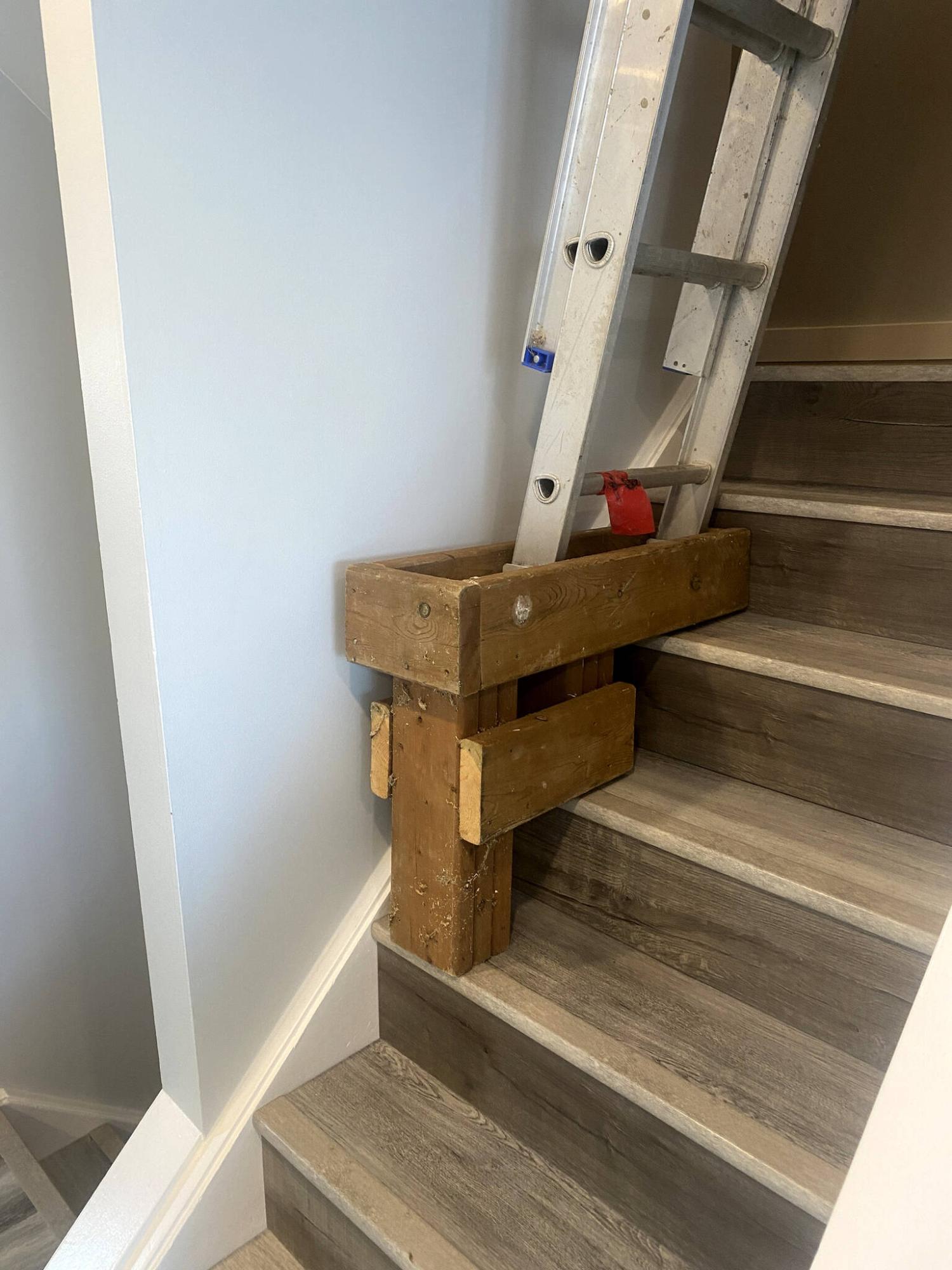  <p>Photos by Marc LaBossiere / Winnipeg Free Press</p>
                                <p>Fashioned from remnant treated lumber nearly a decade ago, Marc&rsquo;s little stair helper continues to serve by providing a level and rigid support for his ladder.</p> 