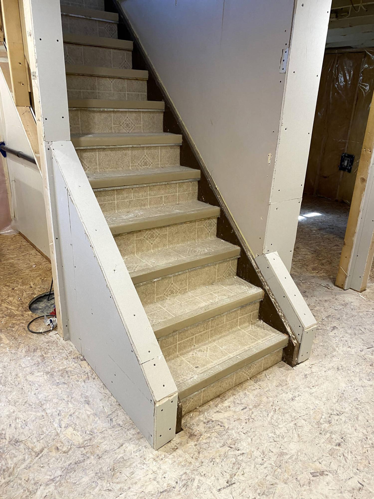  <p>MARC LABOSSIERE / FREE PRESS</p>
                                <p>The decorative stringers are offset to better cater to the floor plan of the rec-room, and laundry entrance.</p> 