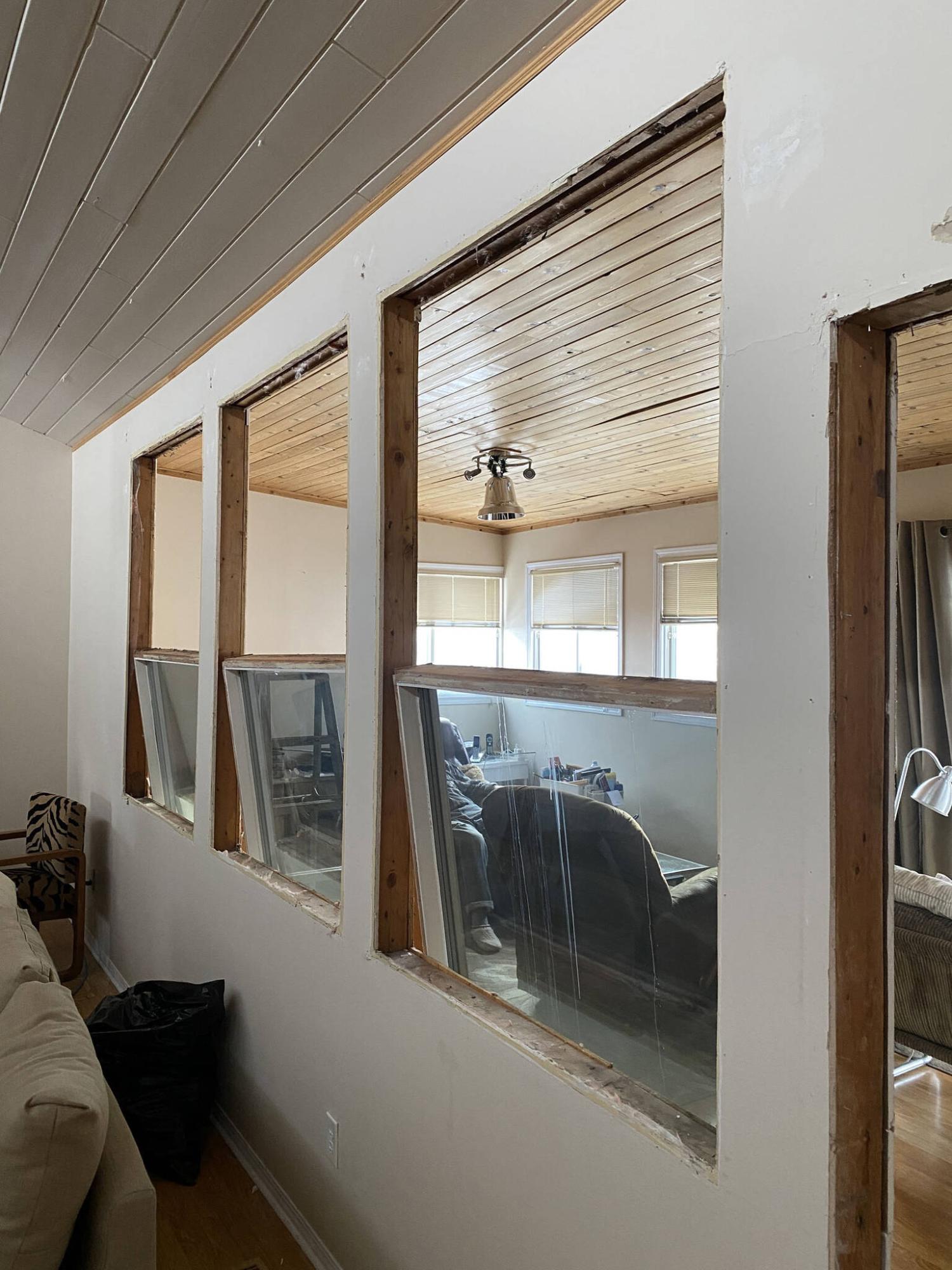  <p>The three windows separating the addition from the existing house are finally removed after many, many years.</p> 