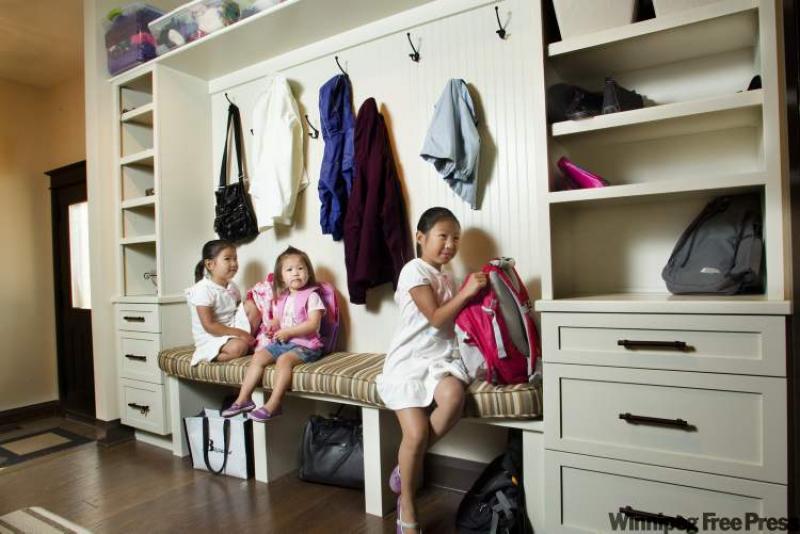 The Su family's new home is an organized affair thanks to cubbies and hooks for three sisters, Juliana, Jenna and Jordana. 