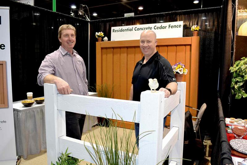 Alan Harder (left) and Andy Stumborg of DDS Consulting exhibited a white-stained concrete fence with a 20-year warranty. The cedar-stained concrete fence panel in the background has been used extensively to enclose large residential developments. Now, Stumborg says, the company is producing rail-type fences that appeal to individual homeowners because they look like wood timber but are virtually maintenance free.