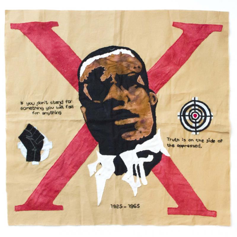 <p>Social Justice Sewing Academy</p><p>The 'X is for Malcolm X' block, created by Bianca Mercado and embroidered by Dr. Melissa Johnson, a professor at Illinois State University, is part of Mercado's Activist ABCs quilt series.</p>