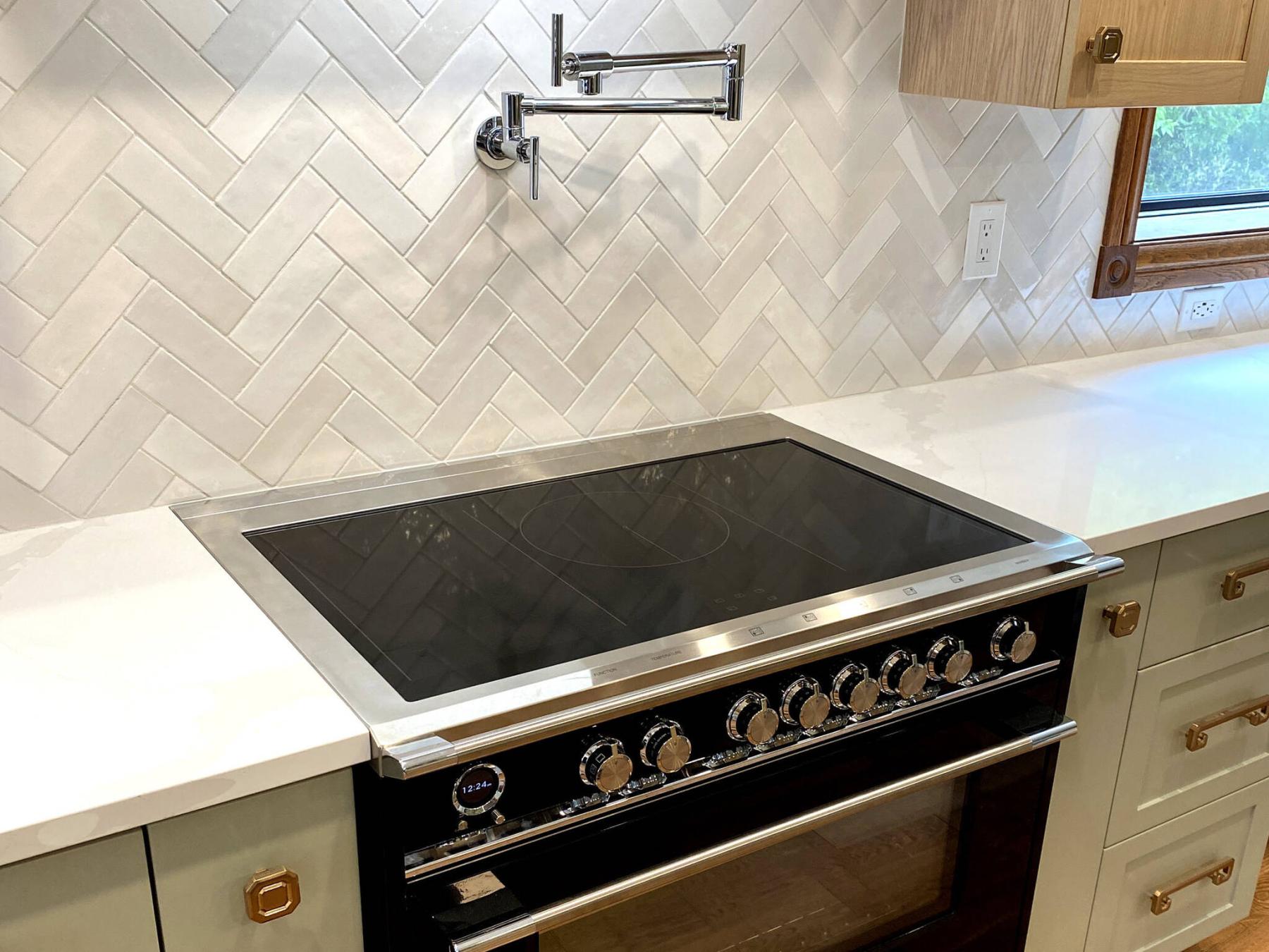  <p>PHOTOS BY MARC LABOSSIERE / FREE PRESS</p>
                                <p>Four separate yet similar rectangular tile colours are chosen for a herringbone design for the main backsplash of a recent kitchen project.</p> 