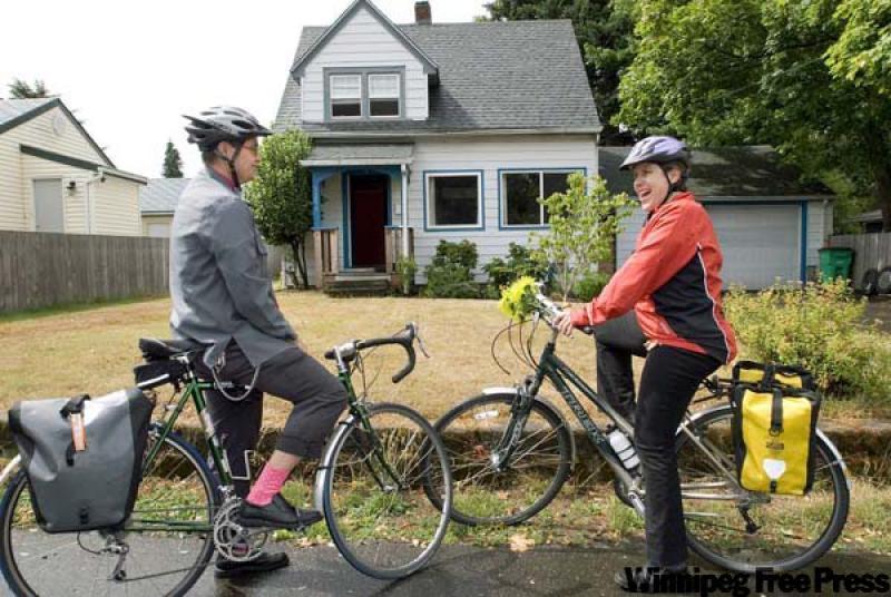 Portland, Ore. realtor Kirsten Kaufman, right, and new home buyer Emily Gardner tour a suburban neighbourhood by bicycle. Kaufman has a monthly bike tour for people who want an alternative to driving
