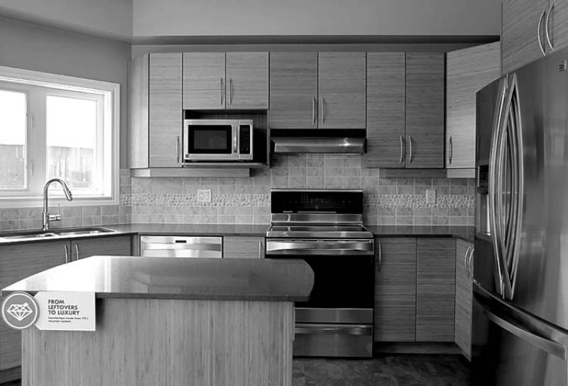 OTTAWA -- The kitchen features bamboo cupboards and quartz countertops. (Julie Oliver/Ottawa Citizen)