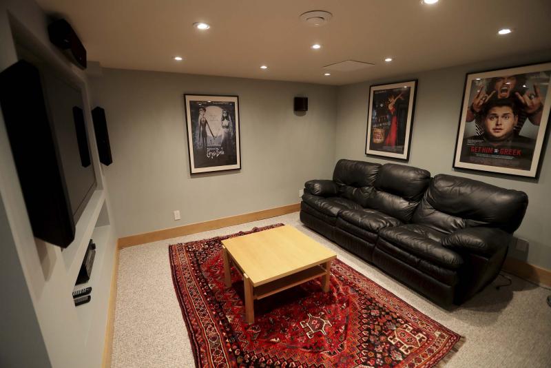 <p>TREVOR HAGAN / WINNIPEG FREE PRESS</p><p>The home's media are features a built-in entertainment unit, pot lights and pair of built-in speakers.</p>