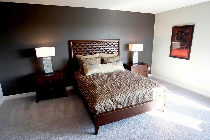 Upstairs is a master suite that is bright and inviting.