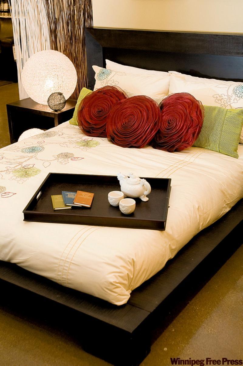 Rose toss cushions and globe lamps are a gorgeous way to give your bedroom ambience. 