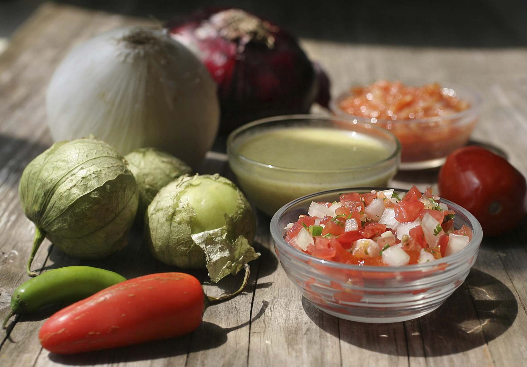 <p>Hillary Levin / TNS files</p><p>Homemade salsas are easy to make and use fresh in-season ingredients. Pictured from front to back are pico de gallo, salsa verde, and tomato salsa. </p>