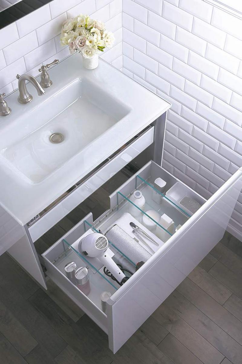 The clever use of the space beneath the sink offers hidden storage and organization of everyday items.