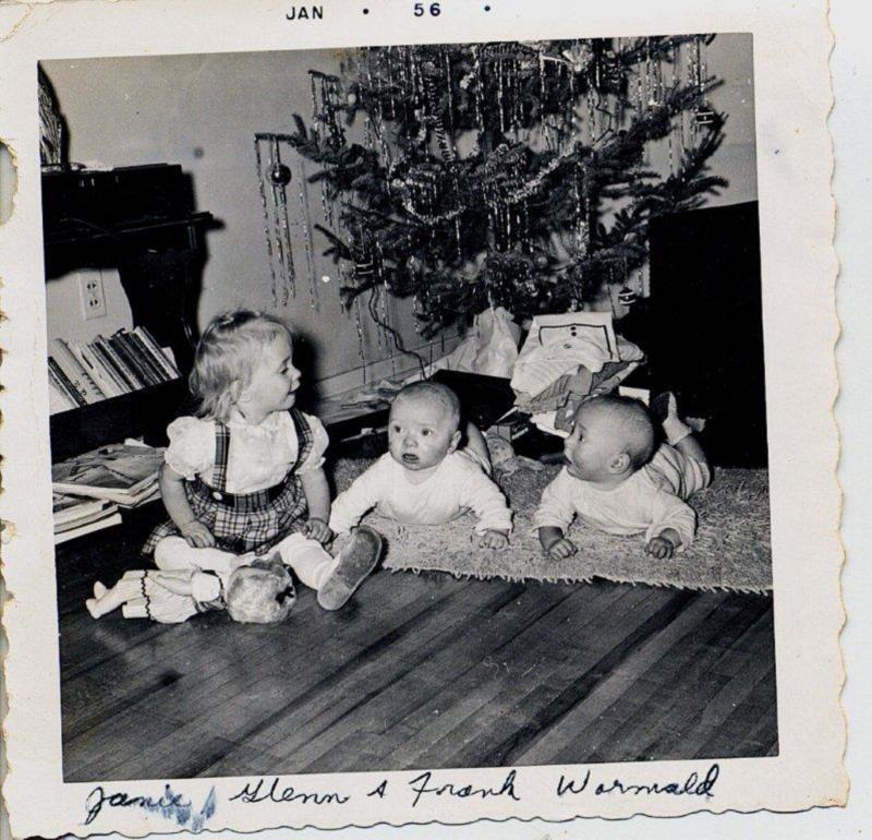 <p>Submitted</p><p>Laurie Mustard's cousin's Glenn and Frank and their older sister Janie hanging out under the Christmas tree circa 1950s. </p>