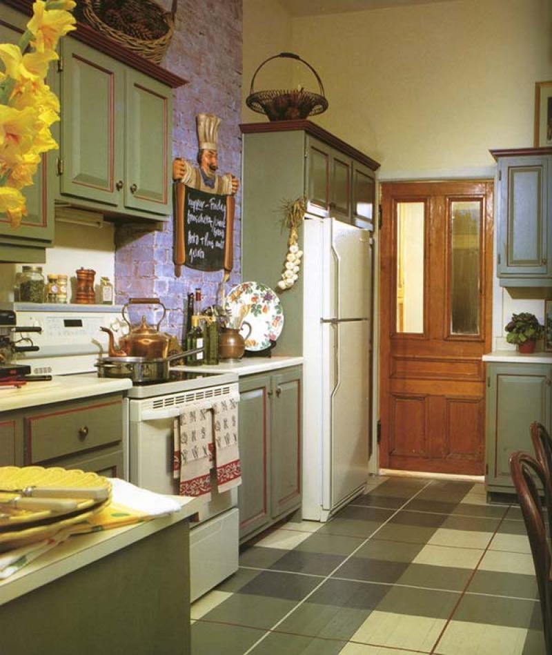 An authentic country finish was applied to the kitchen cabinets with VOC-free milk paint.
