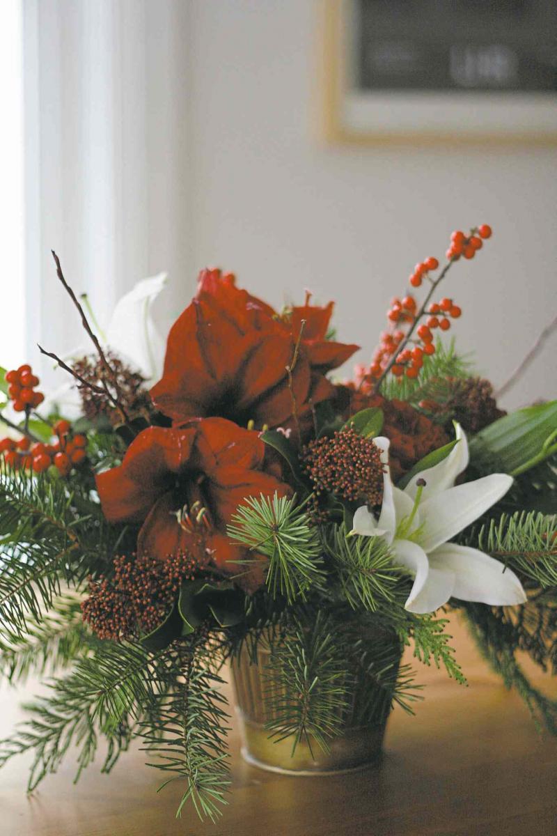 Courtesy of Oak & Lily
Amaryllis, that quintessential flower for the holidays, is paired in this stunning centrepiece with white Casablanca lilies, skimmia, ilex berries and Hearts roses.