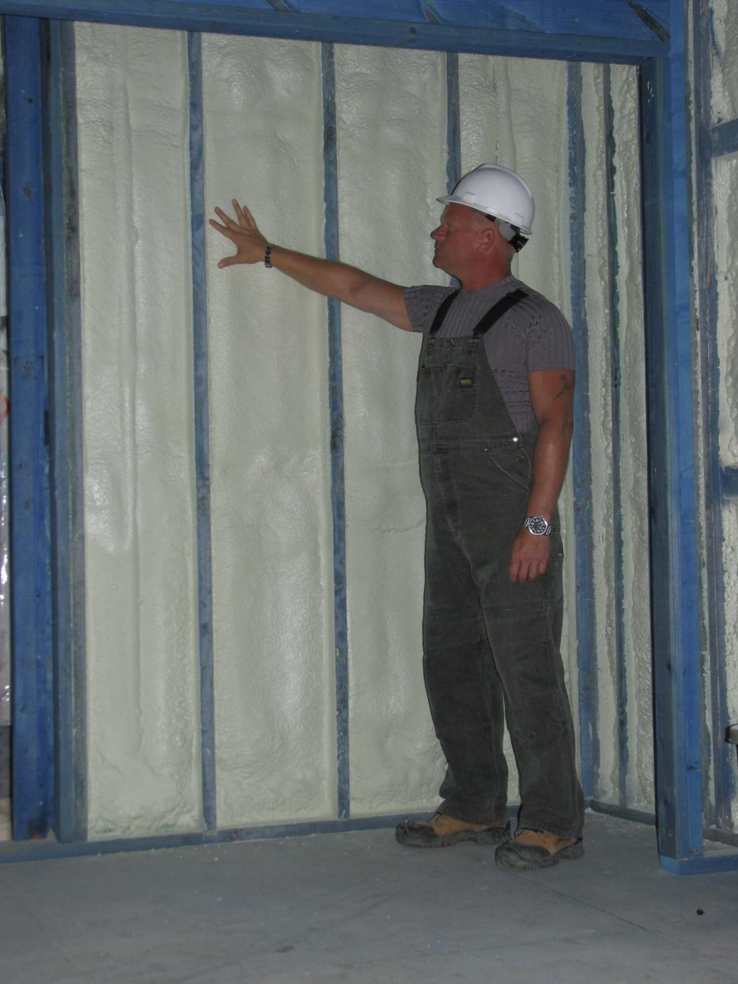 <p>Photo courtesy of The Holmes Group</p><p>The benefits of spraying insulation on the interior are the lack of digging and potential collapse, as well as all the issues with covering, flashing and waterproofing exterior stones.</p>