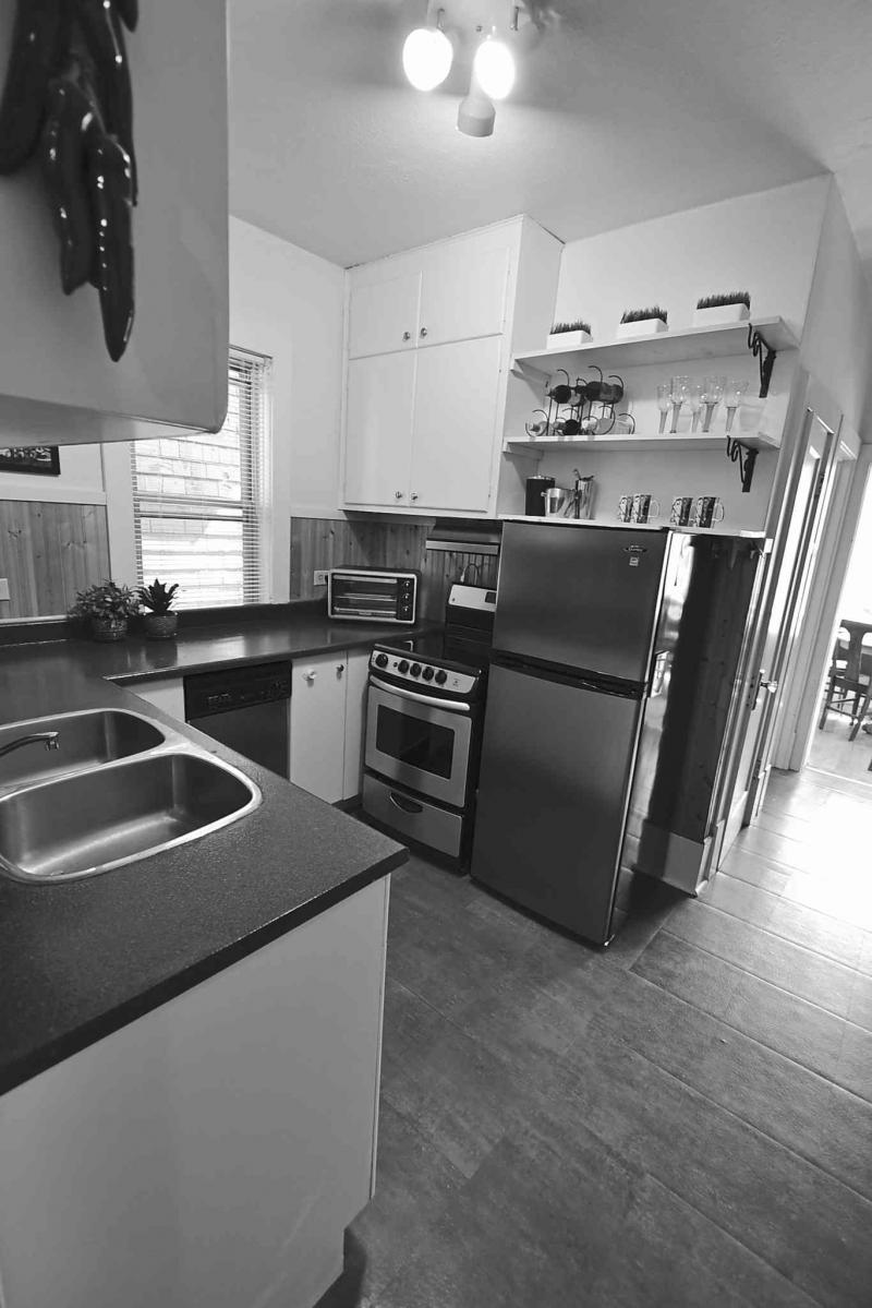With ample counter and cabinet space, stainless steel appliances, a pantry and newer floor, the kitchen offers a high degree of function.