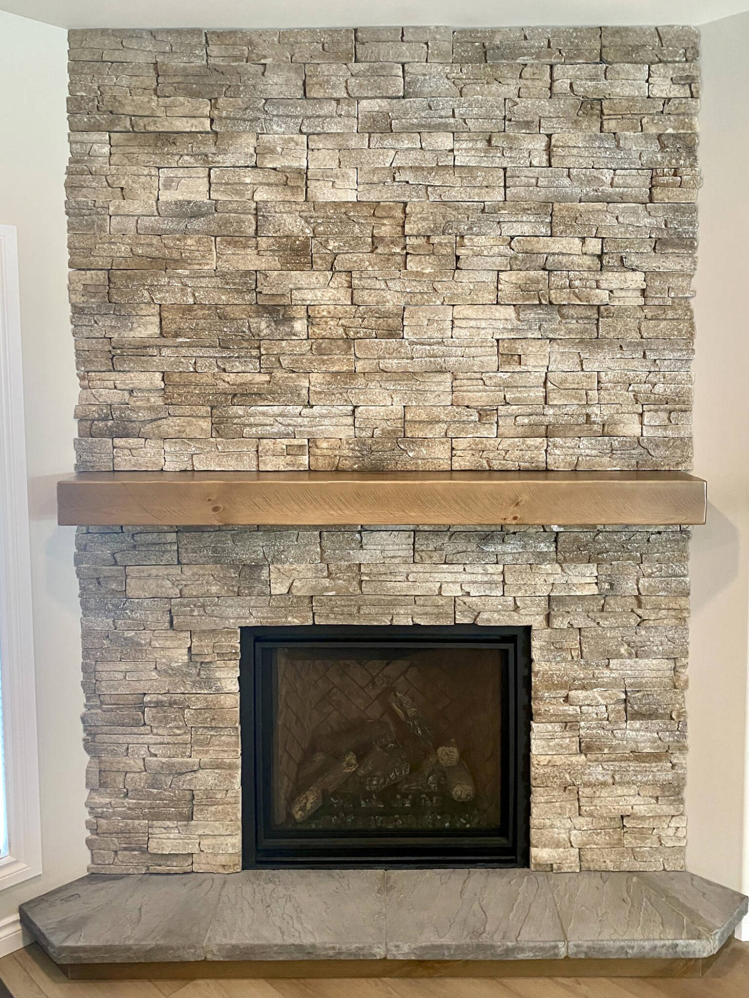  <p>MARC LABOSSIERE PHOTOS / FREE PRESS</p>
                                <p>Stack stone installed from floor to ceiling enhances the look of the new gas fireplace with its custom stained mantel and flat stone hearth.</p> 
