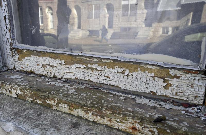 <p>Lloyd Fox / Tribune News Service files</p><p>Odds are lead-containing paint chips outside will just get mowed up or covered up.</p></p>