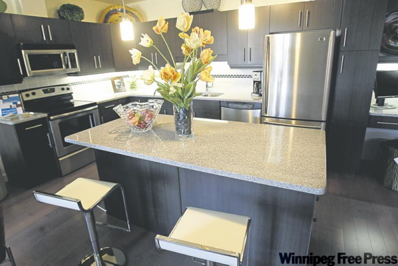 the kitchen has a lot of counter and cabinet space.
