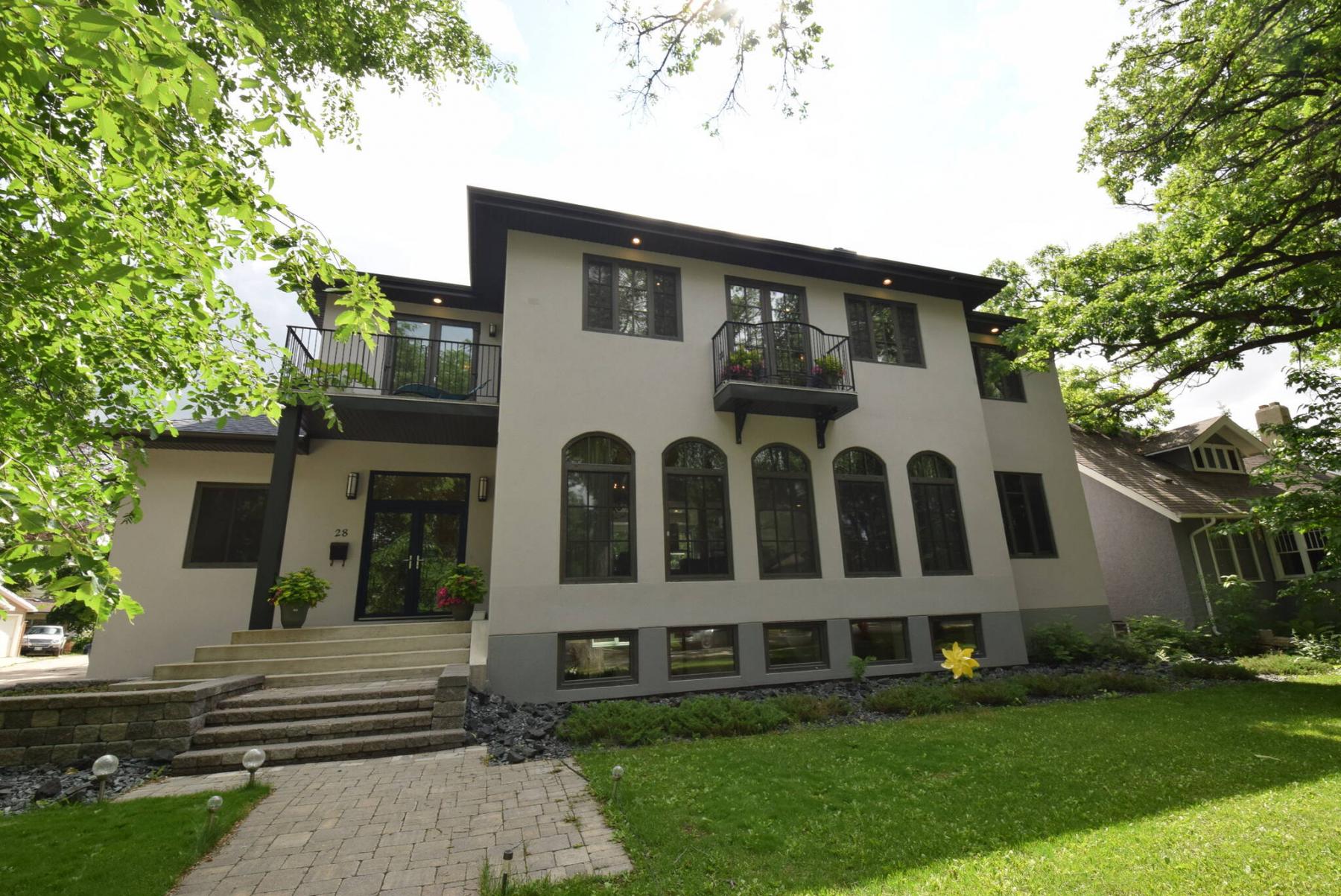  This massive two-storey home fits perfectly on a large, mature lot that’s just steps from Wellington Crescent. 