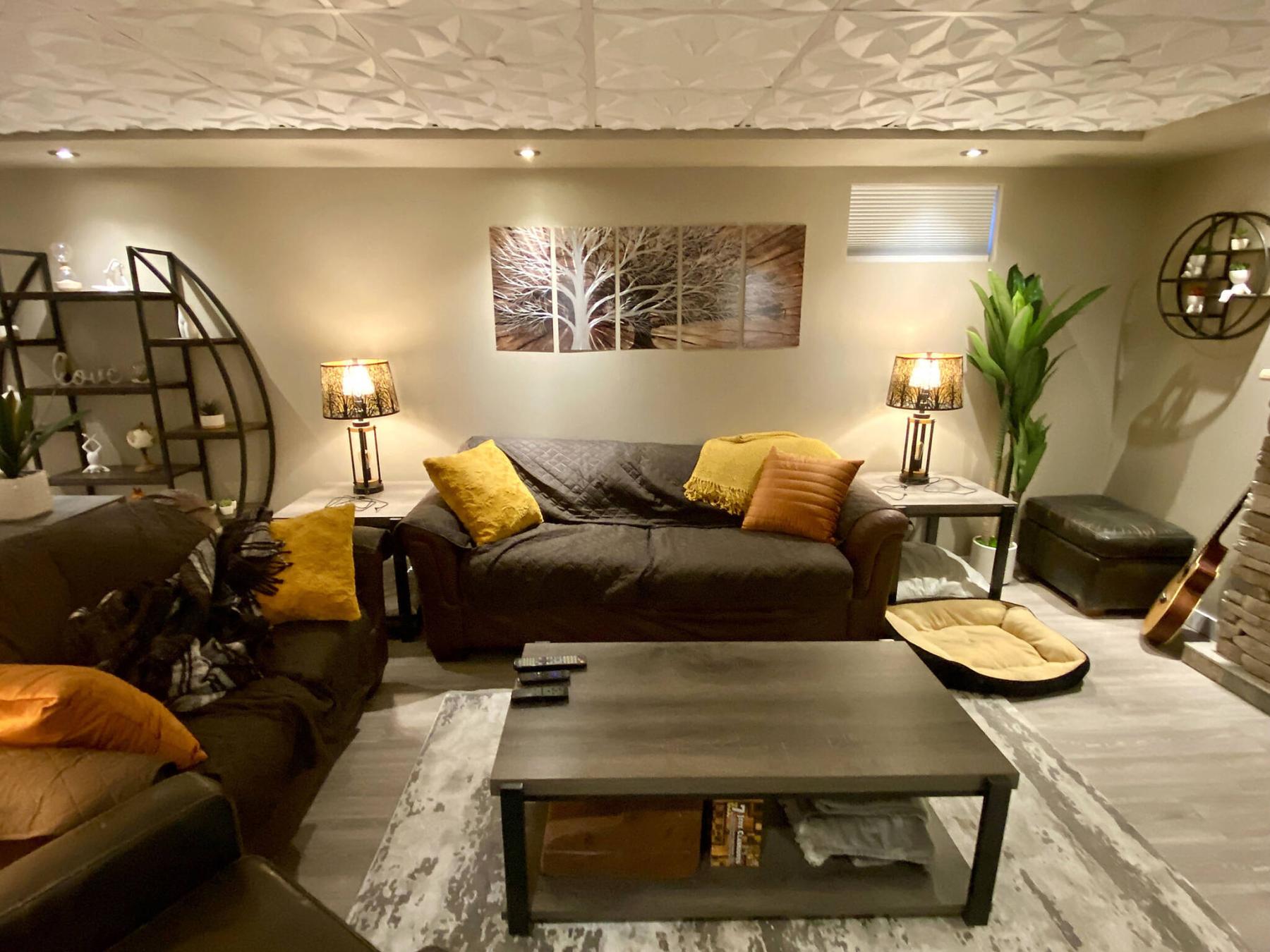  <p>Marc LaBossiere / Free Press</p>
                                <p>Re-purposing the couch, love seat and side chair makes for the mirror image of the living room on the main floor.</p> 