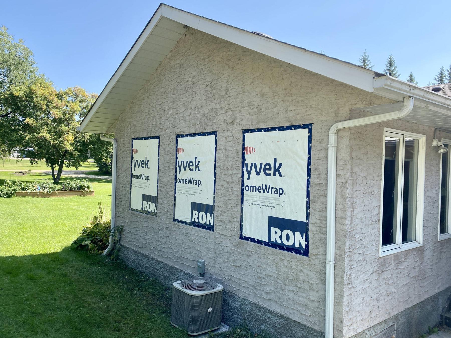  <p>Marc LaBossiere photos / Free Press</p>
                                <p>Outside, the three former window openings are covered in Tyvek and sealed with Tuck tape to protect against the weather.</p> 