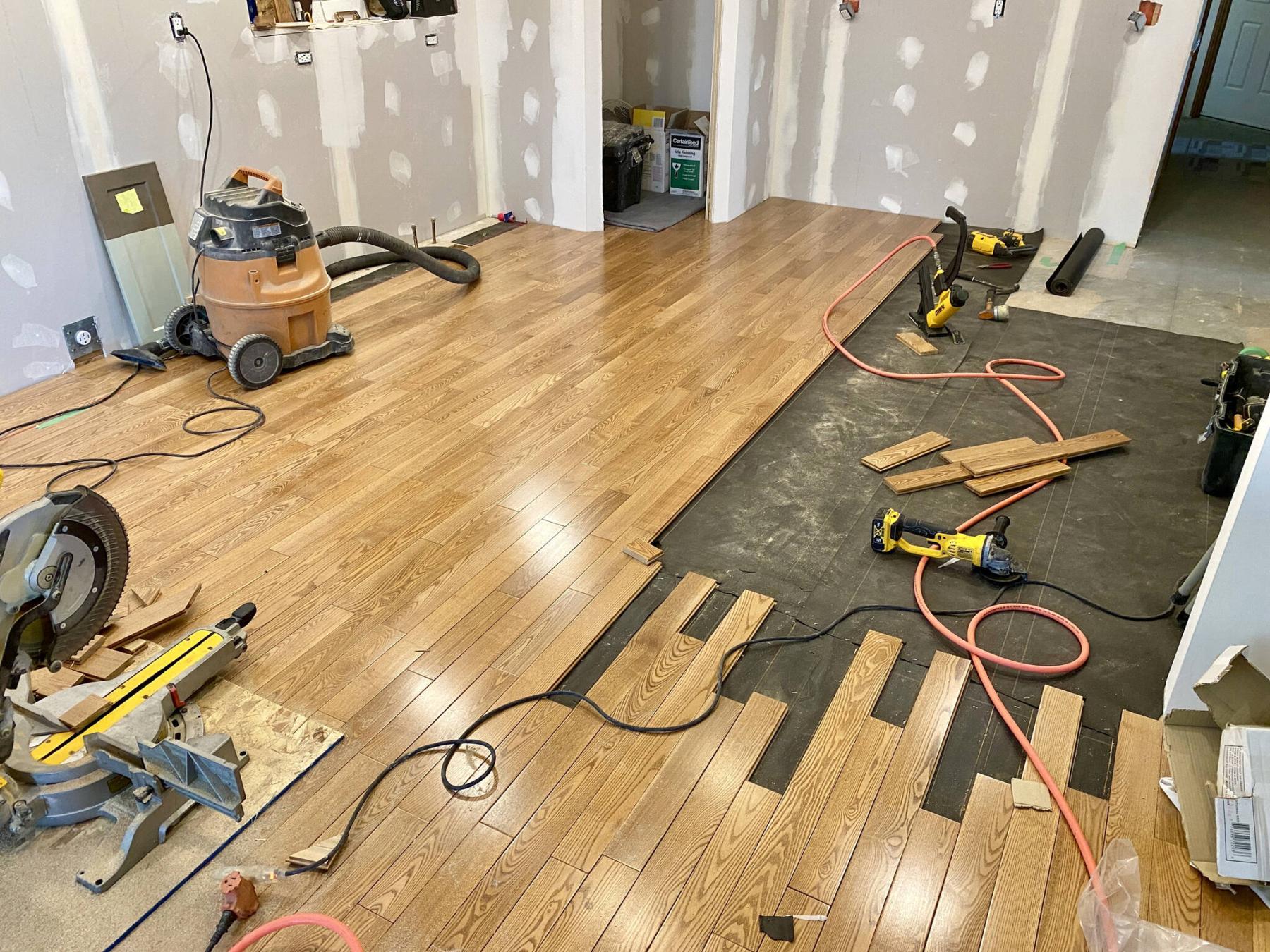  <p>Photos by Marc LaBossiere / Free Press</p>
                                <p>Every second hardwood plank of the existing floor at the old wall line was removed to interlace new boards to best conceal the seam.</p> 