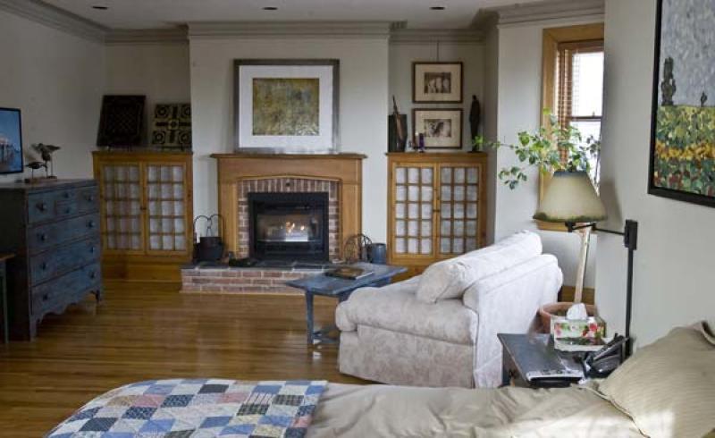 The master bedroom renovation exposed an existing flue and allowed installation of a gas insert.