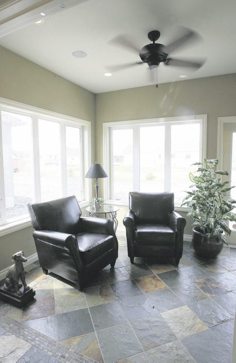 The four-season sunroom is an especially attractive alternative to a third bedroom.
