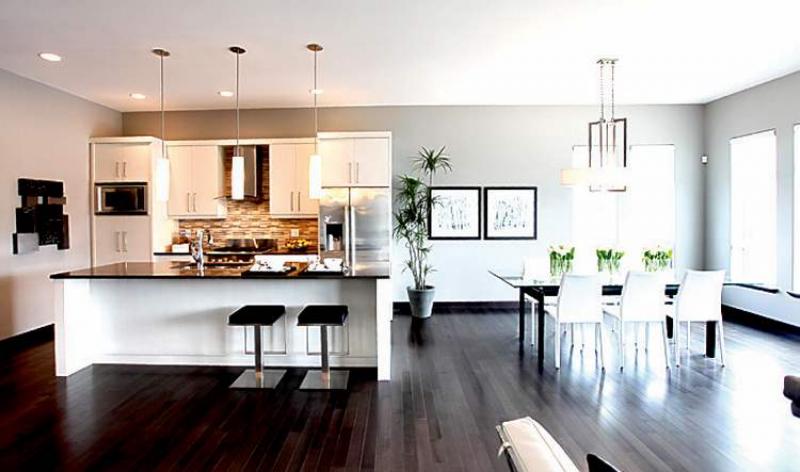 With its 10-foot taupe quartz island (with eating nook for four to five), wide aisles and tons of cabinet and counter space, the kitchen is a gourmetï¿½s dream.