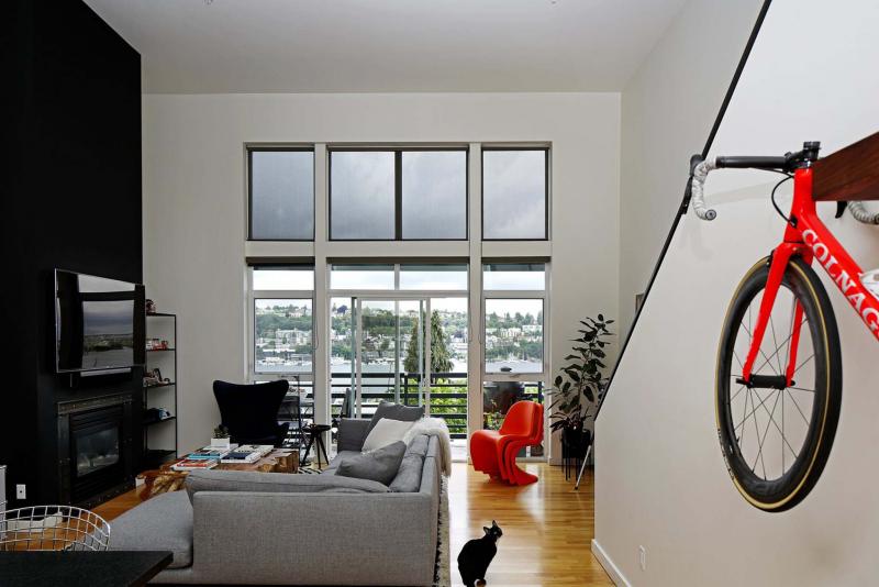 <p>Photos by Ken Lambert / Seattle Times</p><p>‘From the black fireplace that extends from floor to ceiling to the black-and-white striped shag rug, (the pets) reflect the setting of the space,’ interior designer Barbara Hyde Evans says of Max Lemman’s Seattle home.</p>