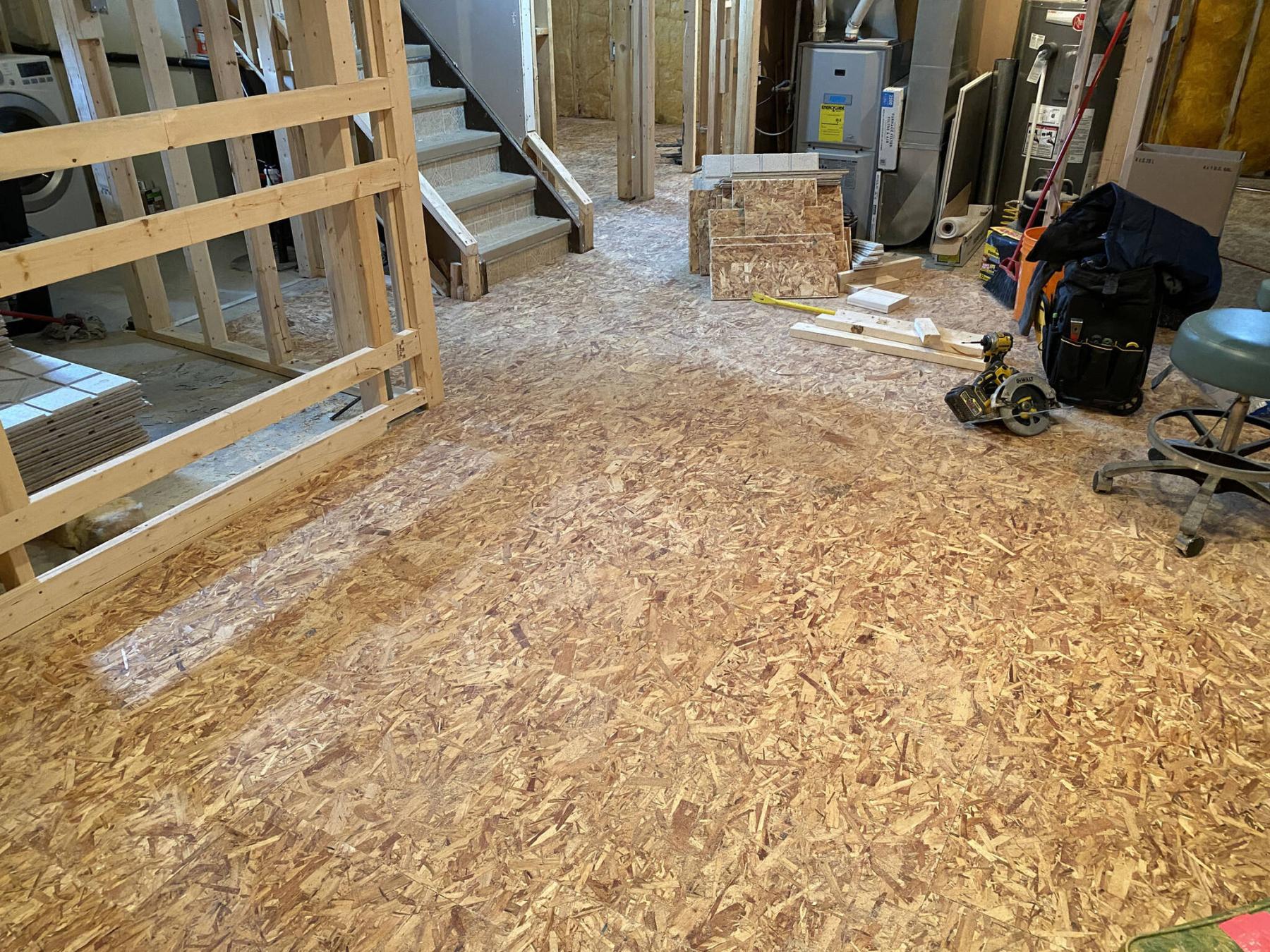  <p>MARC LABOSSIERE / FREE PRESS</p>
                                <p>The subfloor panels are easily installed in the big open area of the home&rsquo;s main rec-room space.</p> 