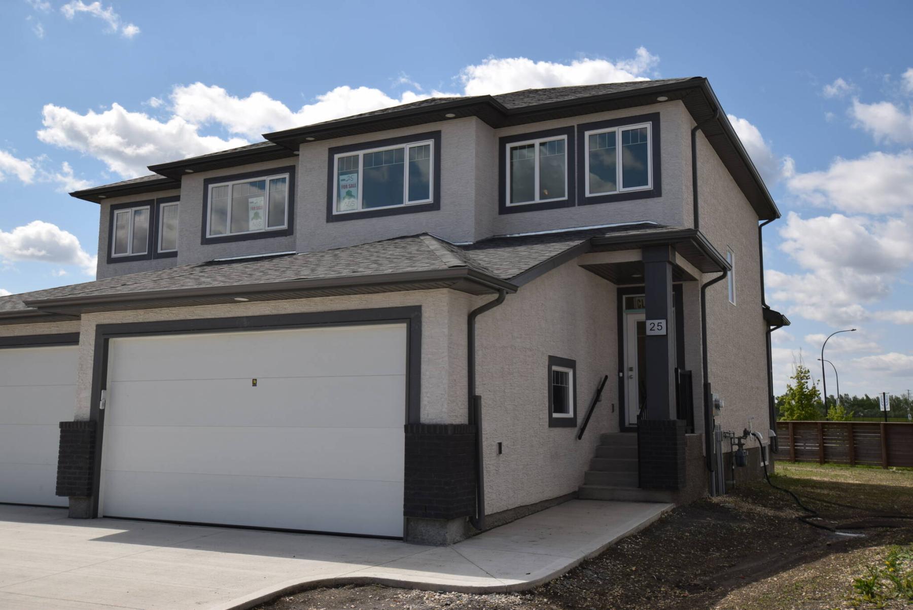  <p>Todd Lewys / Free Press</p>
                                <p>The Onyx, a new single-attached, two-storey model designed by A &amp; S Homes, offers young families a brand new home for under $420,000.</p> 