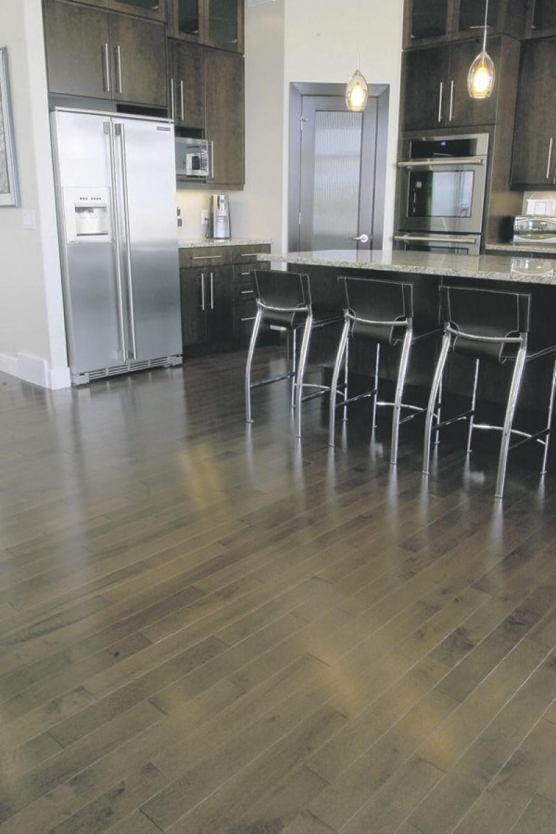 Details such as the choice of dark cabinets and light countertops do much to make this home sing
