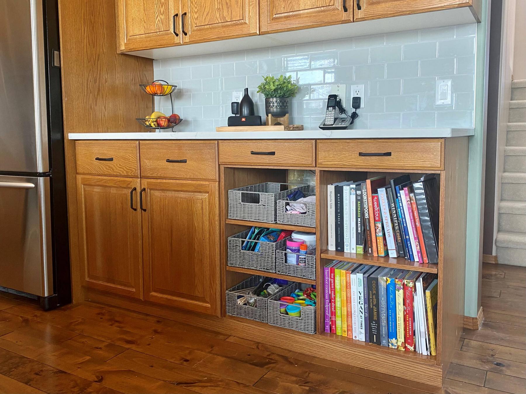 <p>Photos by Marc LaBossiere / Winnipeg Free Press</p><p>The newly fabricated lower cabinet was stained to match the existing doors and shelves.</p>
