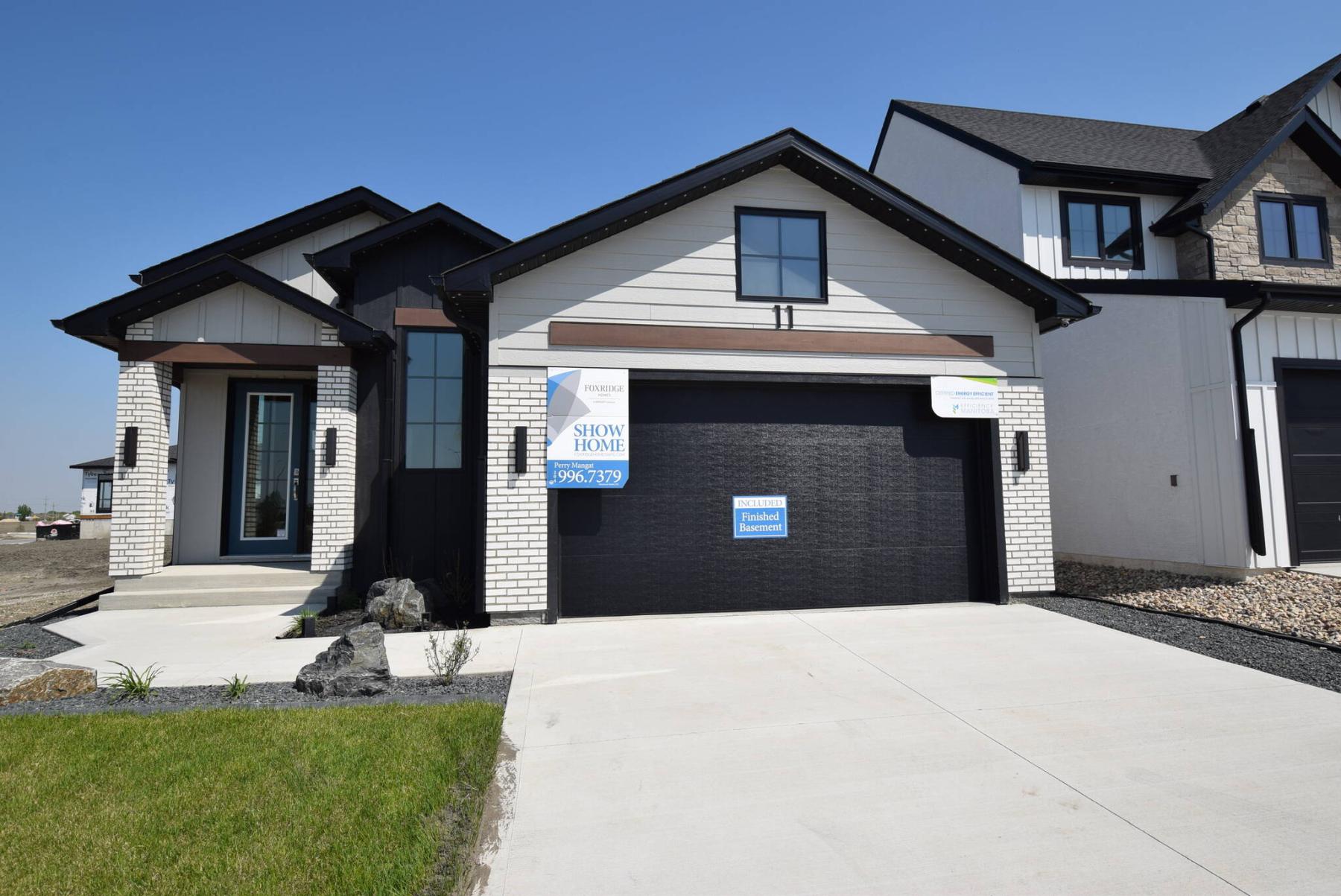  <p>TODD LEWYS / FREE PRESS</p>
                                <p>Sharp-looking outside and featuring a stylish yet sensible layout inside, this beautiful raised bungalow has a finished lower level and offers 2,658 sq. ft. of total living space.</p> 