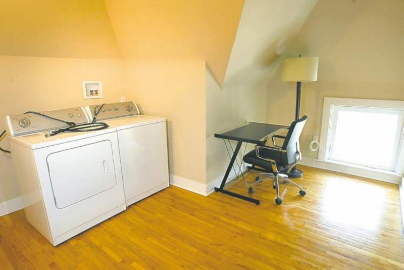The top floor features a laundry area and small office space.