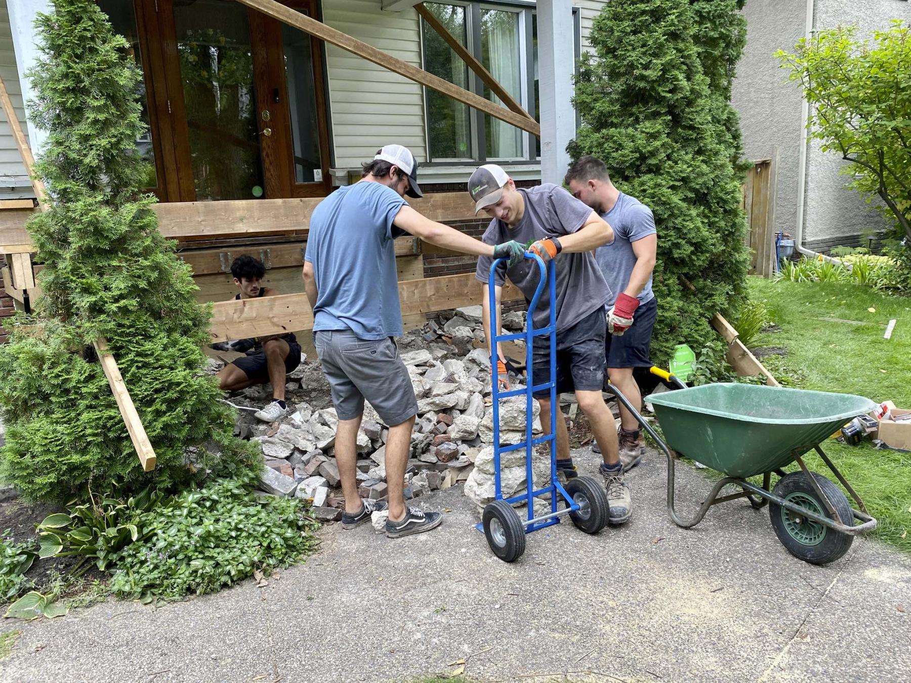 <p></p><p>A crew of four from Student Junk Removal worked hard to clear the porch area of old chunks of concrete. </p></p>