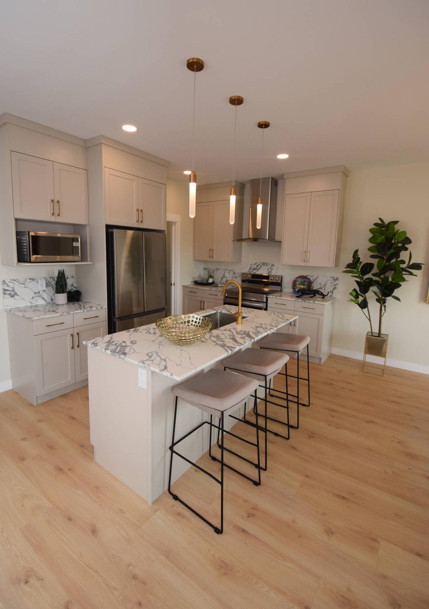  <p>TODD LEWYS / FREE PRESS</p>
                                <p>A true jaw-dropper, the island kitchen at 7 Adara Alley in Aurora at North Point is equal parts style and function.</p> 