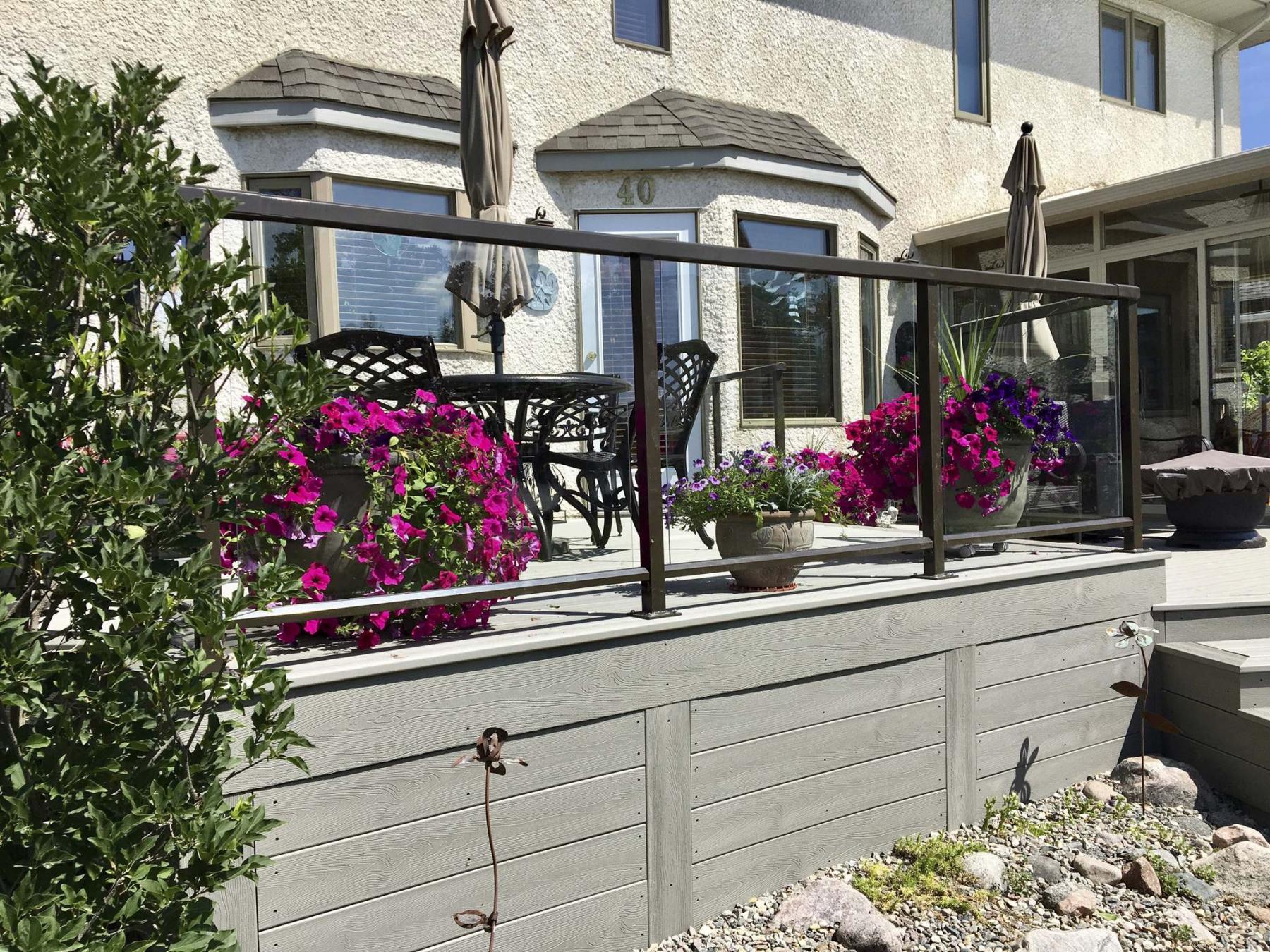 <p>Photos by Marc LaBossiere / Winnipeg Free Press</p><p>This composite deck boasts a glass panel railing system with top-mount railings posts. </p>