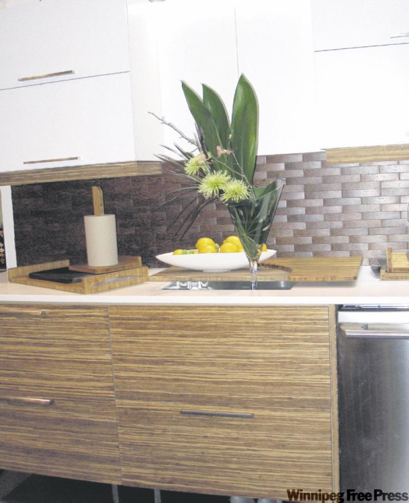 'Green' doesn't need to mean rustic any more, as these cabinets, trimmed with bamboo, show. The striking backsplash is made of woven palm, adding another layer of interest.